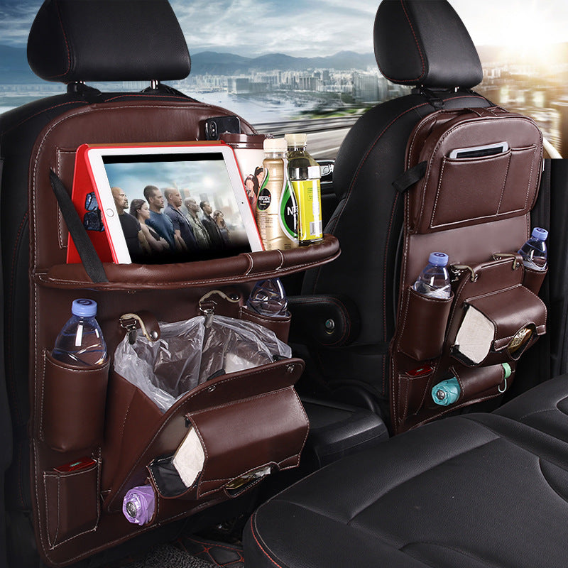 Leather car seat organizer with tablet holder and drink storage for a clutter-free ride.